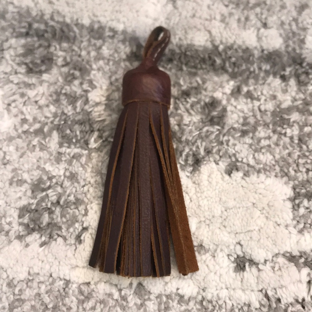 Consuela solid leather tassel pre owned